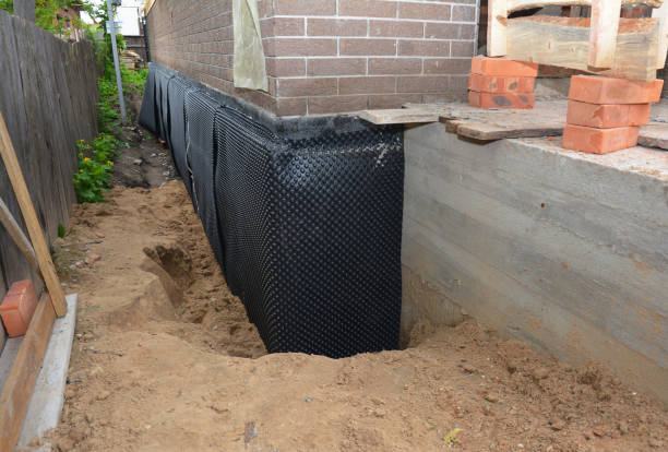 Happy homeowners after waterproofing job in Woodlawn